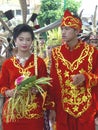 Man and woman in traditional Indonesian dresses
