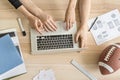 Man and woman using laptop in office