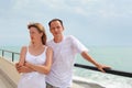 Man and woman on veranda near seacoast Royalty Free Stock Photo