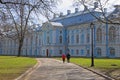 Man and woman on a walk in the courtyard of the Smolny Cathedral Royalty Free Stock Photo