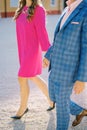 Man and woman walk holding hands along a gravel path near an old villa. Cropped. Faceless Royalty Free Stock Photo