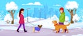 A man and a woman are walking their dogs in a winter park in the snow Royalty Free Stock Photo