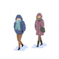 Man and woman walking under falling strong snow, extreme cold winter