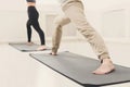 Man and woman warmup stretching training indoors