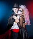 Man and woman wearing as vampire and witch. Halloween