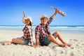Man and woman wearing a plaid shirt raises both hands showing a refreshing Royalty Free Stock Photo