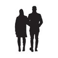 Man with woman in winter clothing walking together forward, isolated vector silhouette. Young couple Royalty Free Stock Photo