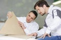 man and woman workers in carpentry workshop