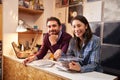 Man and woman working behind the counter at a record shop Royalty Free Stock Photo