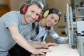 man and woman working in factory wearing ear-defenders Royalty Free Stock Photo