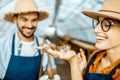 Man and woman working on the farm for snails growing Royalty Free Stock Photo