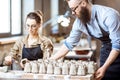 Man and woman working in the pottery shop Royalty Free Stock Photo