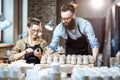 Man and woman working in the pottery shop Royalty Free Stock Photo