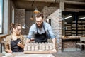 Man and woman working in the pottery shop Royalty Free Stock Photo