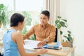 Man and woman working together in an architect office Royalty Free Stock Photo