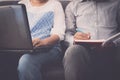 Man and woman workmate working on laptop and notepad in office