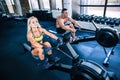 Man and woman workout on training simulator Royalty Free Stock Photo