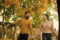 Man and woman at yellow tree leaves. Royalty Free Stock Photo