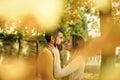 Man and woman at yellow tree leaves. Royalty Free Stock Photo