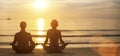 Man and woman yoga silhouettes meditating on Sea coast. Royalty Free Stock Photo