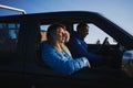 Male driver and female passenger in black car. Royalty Free Stock Photo