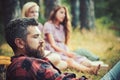 Man and women on blurred background in wood. Hiking, camping, lifestyle concept
