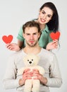 Man and woman couple in love hold red heart valentines cards white background. Man and pretty girl in love. Valentines Royalty Free Stock Photo