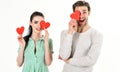 Man and woman couple in love hold red heart valentines cards on white background. Romantic couple in love. Romantic Royalty Free Stock Photo