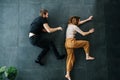 Couple playing chase scene, running while lying on the floor