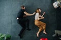 Man and woman depict running while lying on the floor Royalty Free Stock Photo