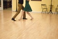 Waltz by young couple in the dance studio