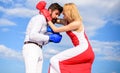 Man and woman fight boxing gloves sky background. Attack is best defence. Couple in love boxing. Women can fight back