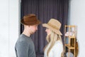 Loving couple in hats face profile, male female couple. Looking at each other