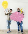 Man and woman holding bulb and pink cloud icons respectively