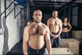 Friends relaxing and taking a break after working out at a cross-training gym Royalty Free Stock Photo