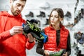 Man and woman choosing shoes for mountain hiking