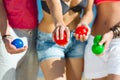 Man and women playing boule on beach