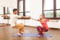 Man and woman practicing partner yoga