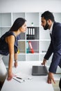 Man and woman staring at each other with hostile expressions. Royalty Free Stock Photo