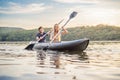 Man and woman swims on kayak in the sea on background of island. Kayaking concept.Kayaking concept with family of father Royalty Free Stock Photo