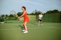 Man and woman on tennis training, outdoor court