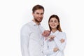 man and woman in white shirts are standing next to each other smile communication family