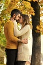 Man and woman at yellow tree leaves. Royalty Free Stock Photo