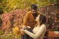 Man and woman with yellow tree leaves. Royalty Free Stock Photo