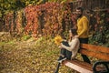 Man and woman with yellow tree leaves. Royalty Free Stock Photo