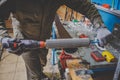 A man worker repairs in the ski service workshop the sliding surface of the skis, Base polishing, final ski polishing. In the hand