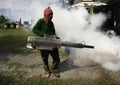 Man work fogging to eliminate mosquito for preventing spread den