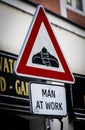 man at work street sign