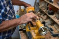 The woodturner work. Man`s arms with cutter in action. Royalty Free Stock Photo