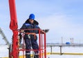 Man worker in a boom lift, machine control on the aerial platform Royalty Free Stock Photo